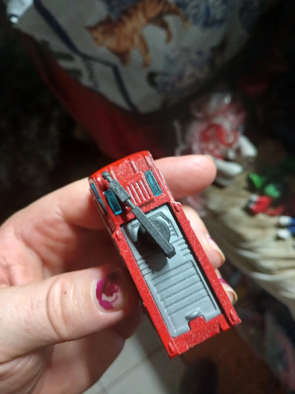 Matchbox Airport Fire Tanker toy vehicle, featuring a red body and a black water